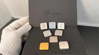 Precious metals set with 8 bars including osmium, iridium, and rhodium in presentation box with MetaMetals logo.